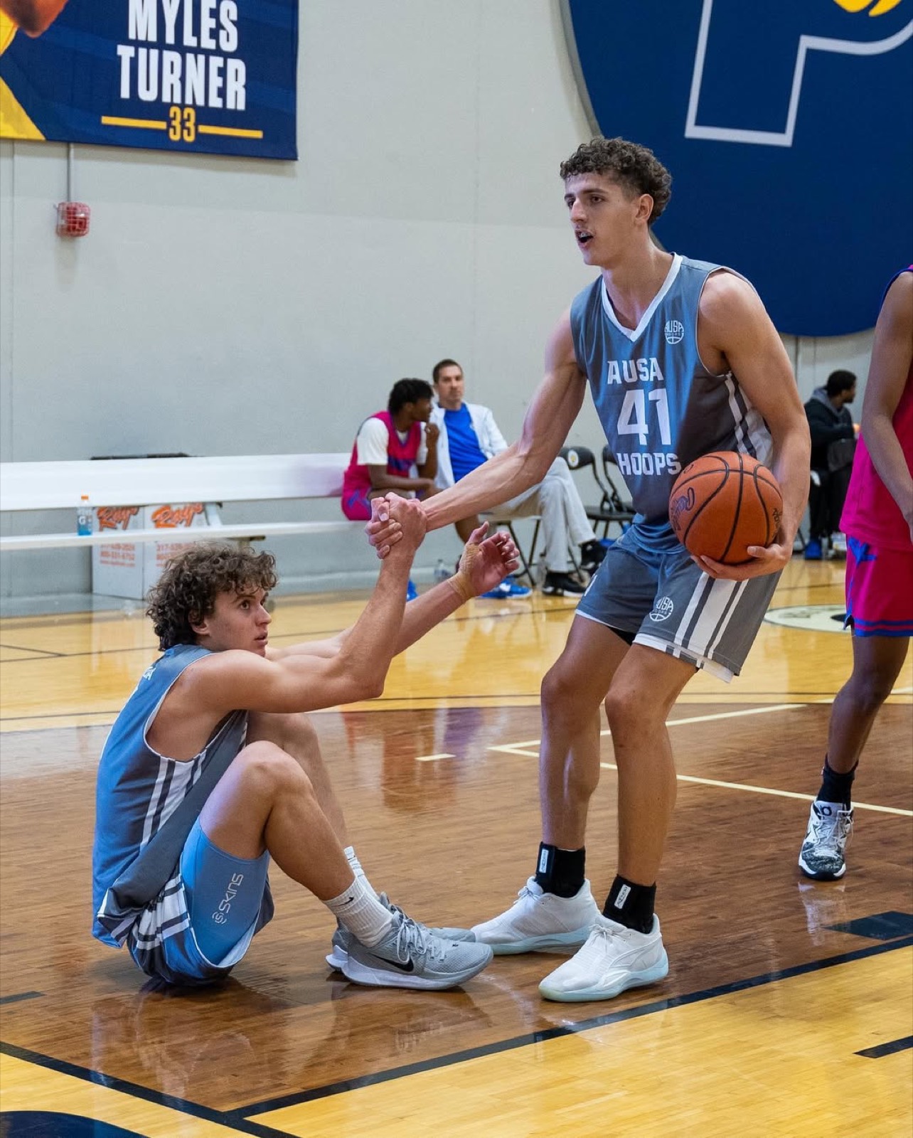 Players helping each other up mid game