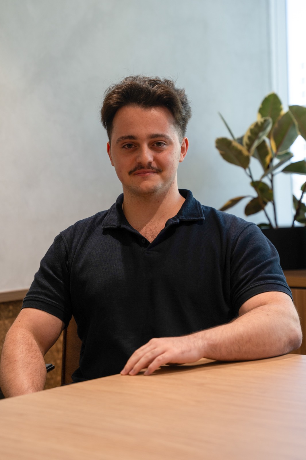Corporate headshot at a desk