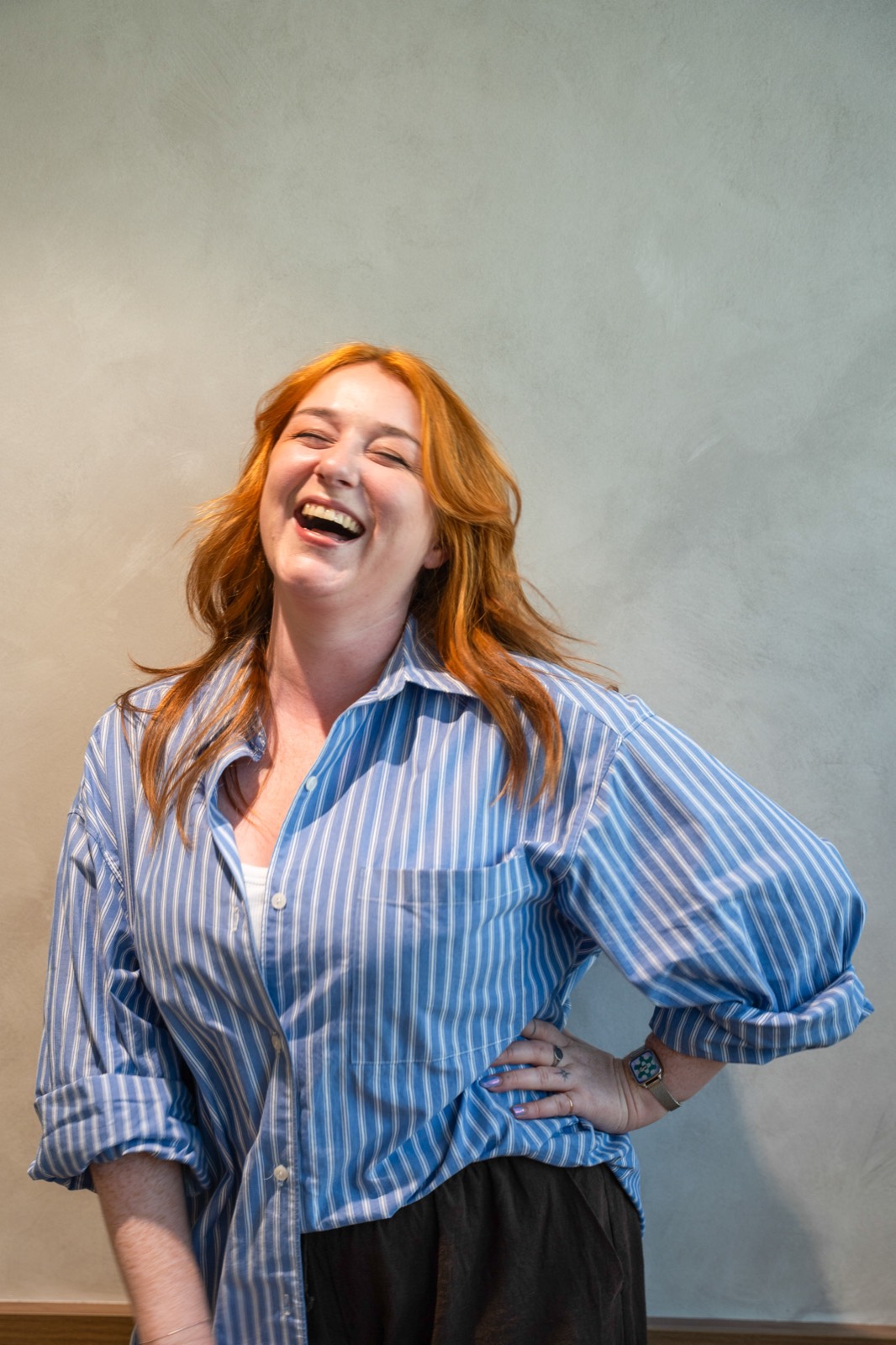 Corporate headshot, natural laugh