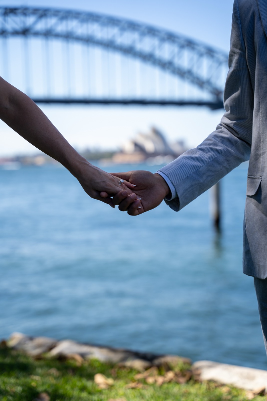 Holding hands, harbour bridge behind